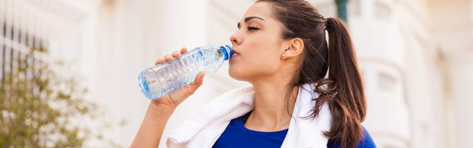 Woman drinking water.