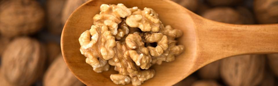 Wooden spoon with walnuts